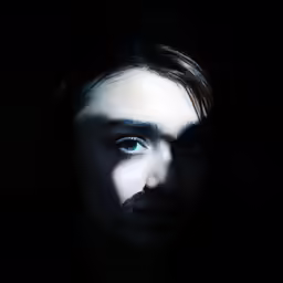 a man has blue eyes with a mustache