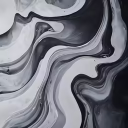an artistic black and white background with large waves