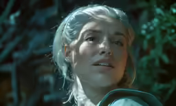 a blonde lady wearing a white shirt looking up at something