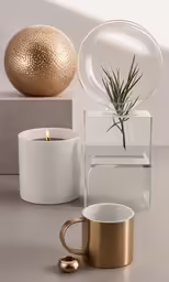 two coffee cups are next to a tealight holder