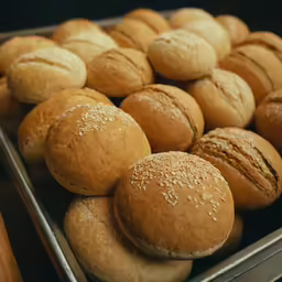closeup image of freshly baked buns in metal tin