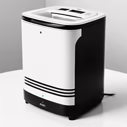 a small computer on a table and a black mouse