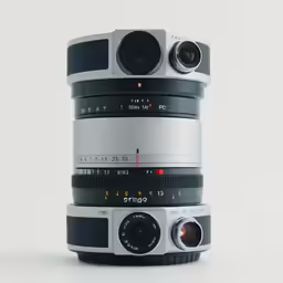 multiple large slr lens stacked next to each other