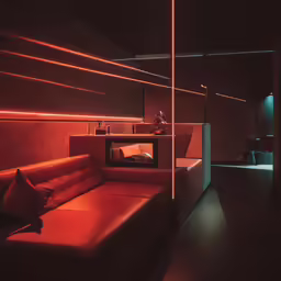 an extremely modern room has many orange lights