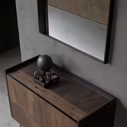 the antique table is placed in front of a mirror