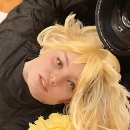 the woman with blond hair has a frumped up, blonde hairs