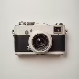 an old - fashioned camera is displayed against a white background