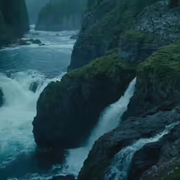 water rushing down the side of a large river
