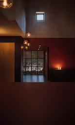 a hallway is lit by lights in an apartment