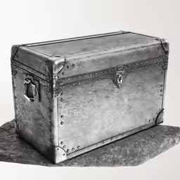 an old suit case that is on top of a cloth