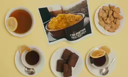 a spread out on the table that shows different foods and beverages