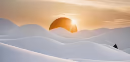 the silhouette of the person stands in the white desert