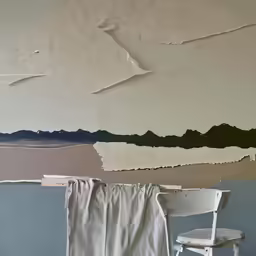 a paint peeling off a wall with chair in front