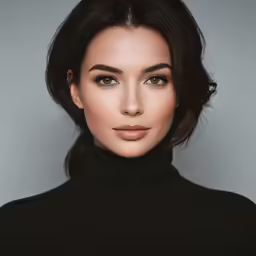 a beautiful woman in black shirt posing for the camera