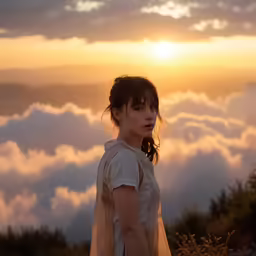 there is a woman that is standing in the mountains