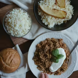 a person holding up a plate of food