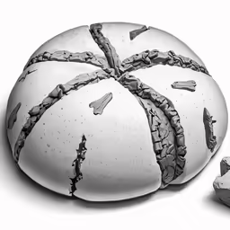 a large round rock with multiple layers on top of it