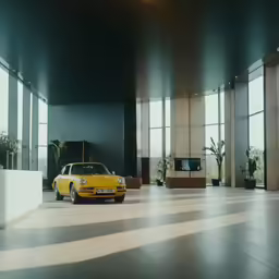 a car is sitting in a very large room