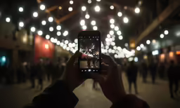 someone taking a picture on a mobile phone