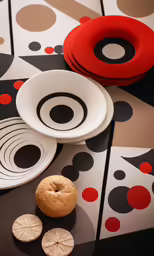 plates and bowls are laid out on top of a table