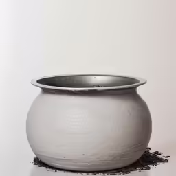 a white container with some dirt in it