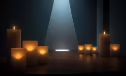 many white lit candles stand in a circle