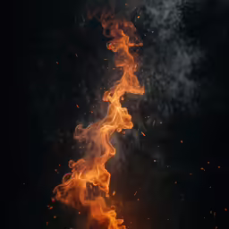 a long fire with smoke coming out of it