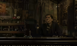a man is sitting at a bar and staring