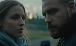two people are staring into the distance