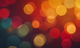 a close up of brightly colored lights in the night sky