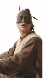 a boy wearing a leather mask and a costume