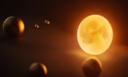 a yellow moon lit by a black background with white and orange spheres