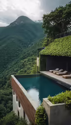 there is a long pool surrounded by green hills