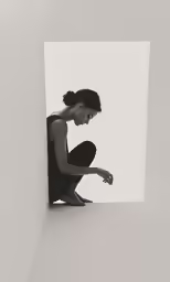 a woman is crouched down and holding her hands on her knees
