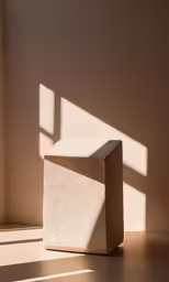 a stone structure sits in a corner with a sun window on the other side