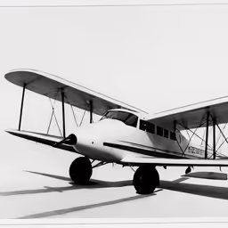small propeller airplane parked on a field with no passengers