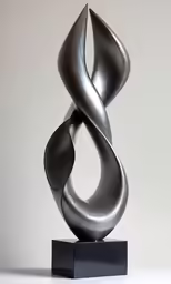 a metal sculpture sitting on top of a table
