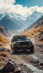 a white and black truck traveling on a trail