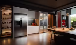 a kitchen that has a refrigerator and some windows in it