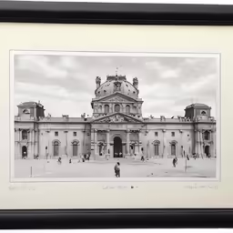 a photograph of an old building in a frame