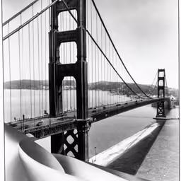 a view from the top of a bridge that stretches across water