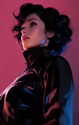 a woman with dark hair wearing a black leather top and jacket