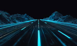 an empty road with mountains on each side