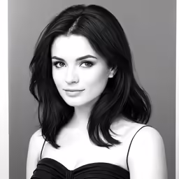 a woman is in black and white with long dark hair