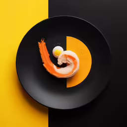 an egg is in the middle of a black plate