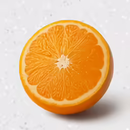 a orange cut in half sitting on top of a table