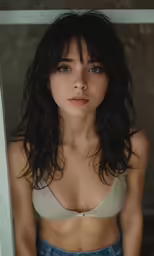 a woman with her eyes closed is sitting down