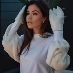 a woman in white is wearing a blouse