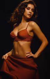 a women with her hands on her hips wearing a bra