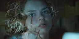 woman in motion, staring at camera, slightly open eyes